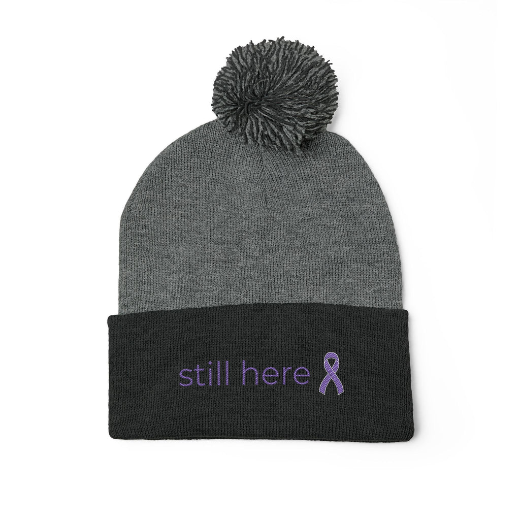 Still Here Pom-Pom Beanie – Epilepsy Awareness Knit Hat with Purple Ribbon