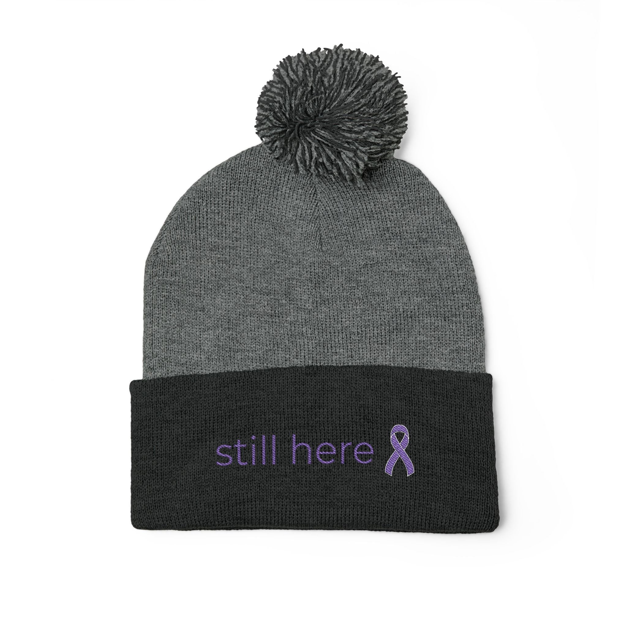 Still Here Pom-Pom Beanie – Epilepsy Awareness Knit Hat with Purple Ribbon