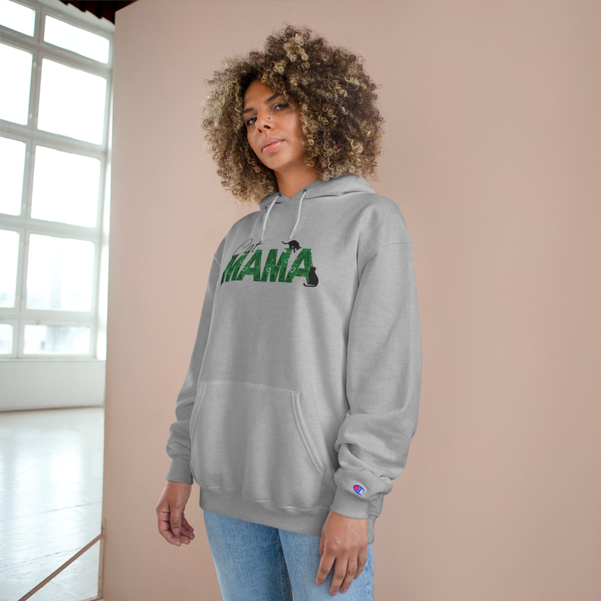 Photo depicting the ​Christmas Cat Mama Champion Hoodie from EpiAl's Shop.