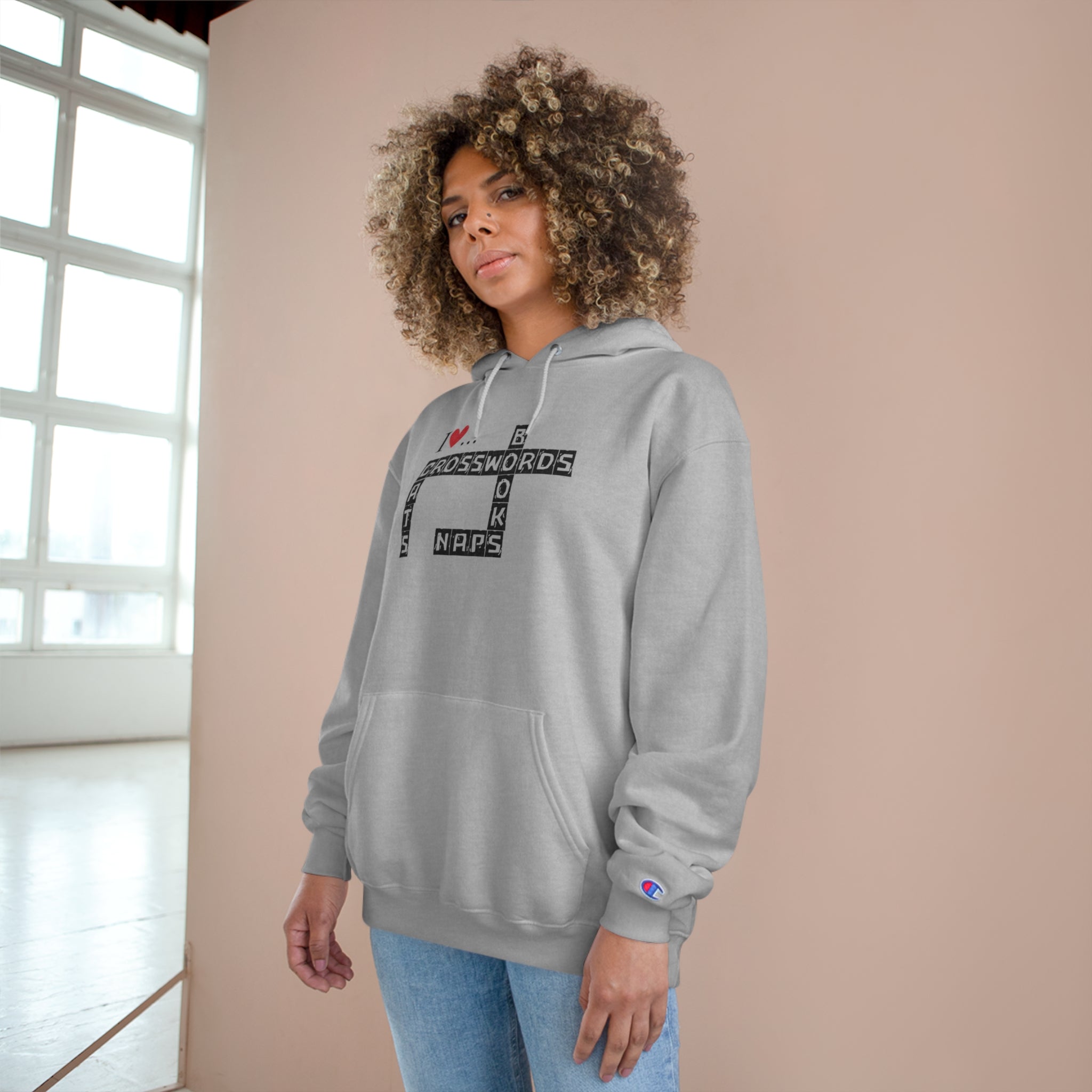 Photo depicting the ​Crosswords and Cats Champion Hoodie from EpiAl's Shop.