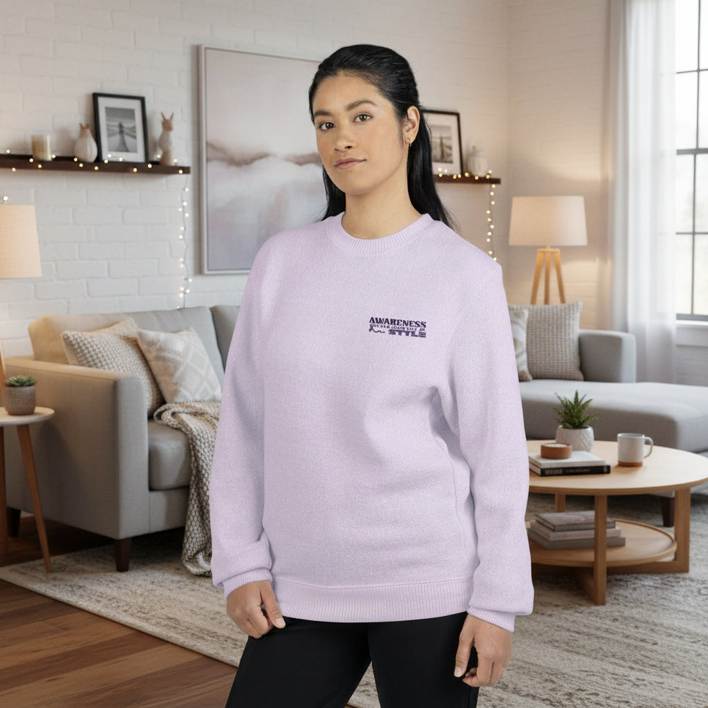 woman standing in a living room wearing a purple sweatshirt