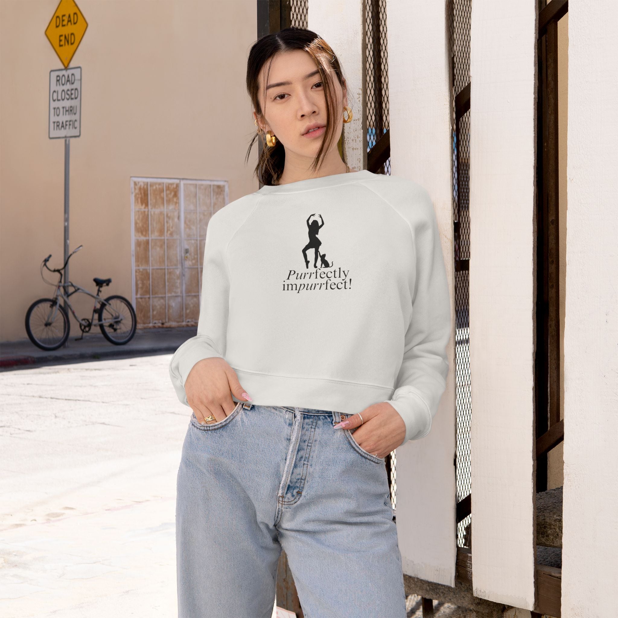 Photo depicting the ​Purrfectly Impurrfect Women's Cropped Fleece Pullover from EpiAl's Shop.
