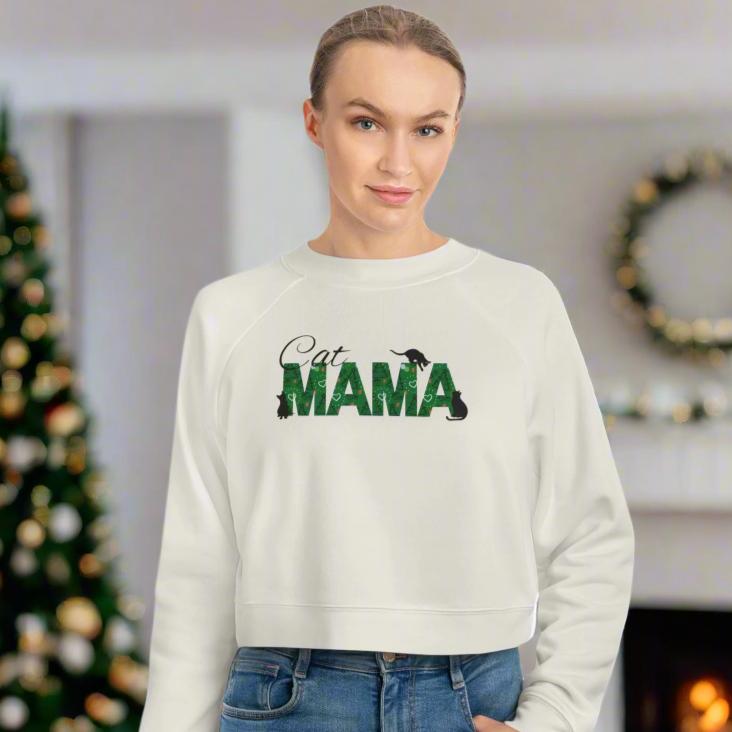 Photo depicting the ​Christmas Cat Mama Women's Cropped Fleece Pullover from EpiAl's Shop.
