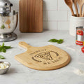 “In Crust We Trust” Engraved Bamboo Pizza Board – Political Parody Pizza Paddle