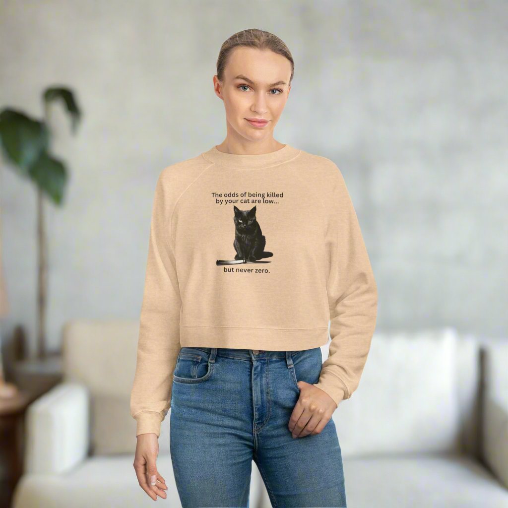 Photo depicting the ​Odds Your Cat's a Killer Women's Cropped Fleece Pullover from EpiAl's Shop.