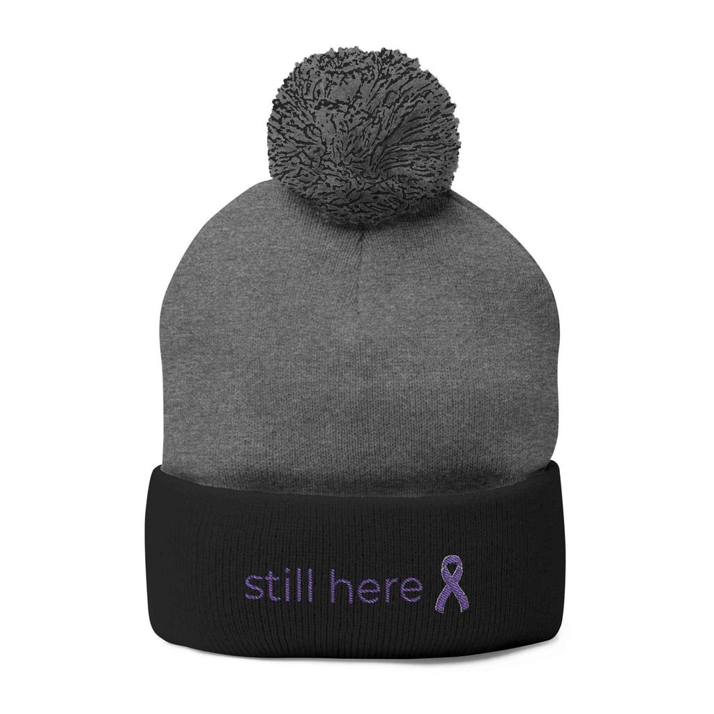Still Here Pom-Pom Beanie – Epilepsy Awareness Knit Hat with Purple Ribbon