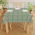 Photo depicting the ​Meowy Gingham Christmas Tablecloth from EpiAl's Shop.