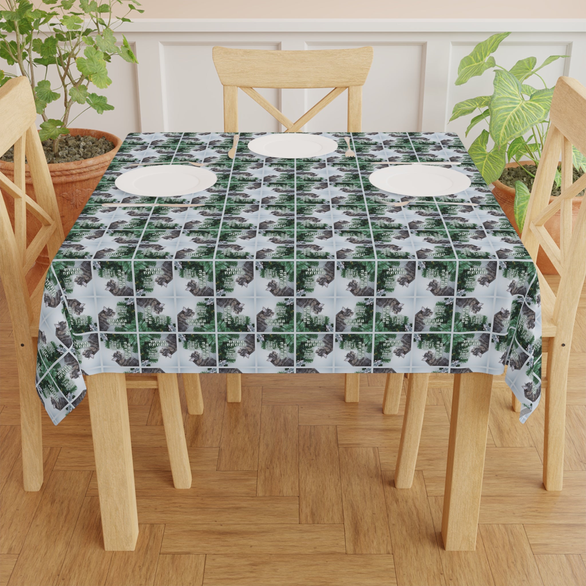 Photo depicting the ​Wreck the Halls & Blame the Puppy Christmas Tablecloth from EpiAl's Shop.
