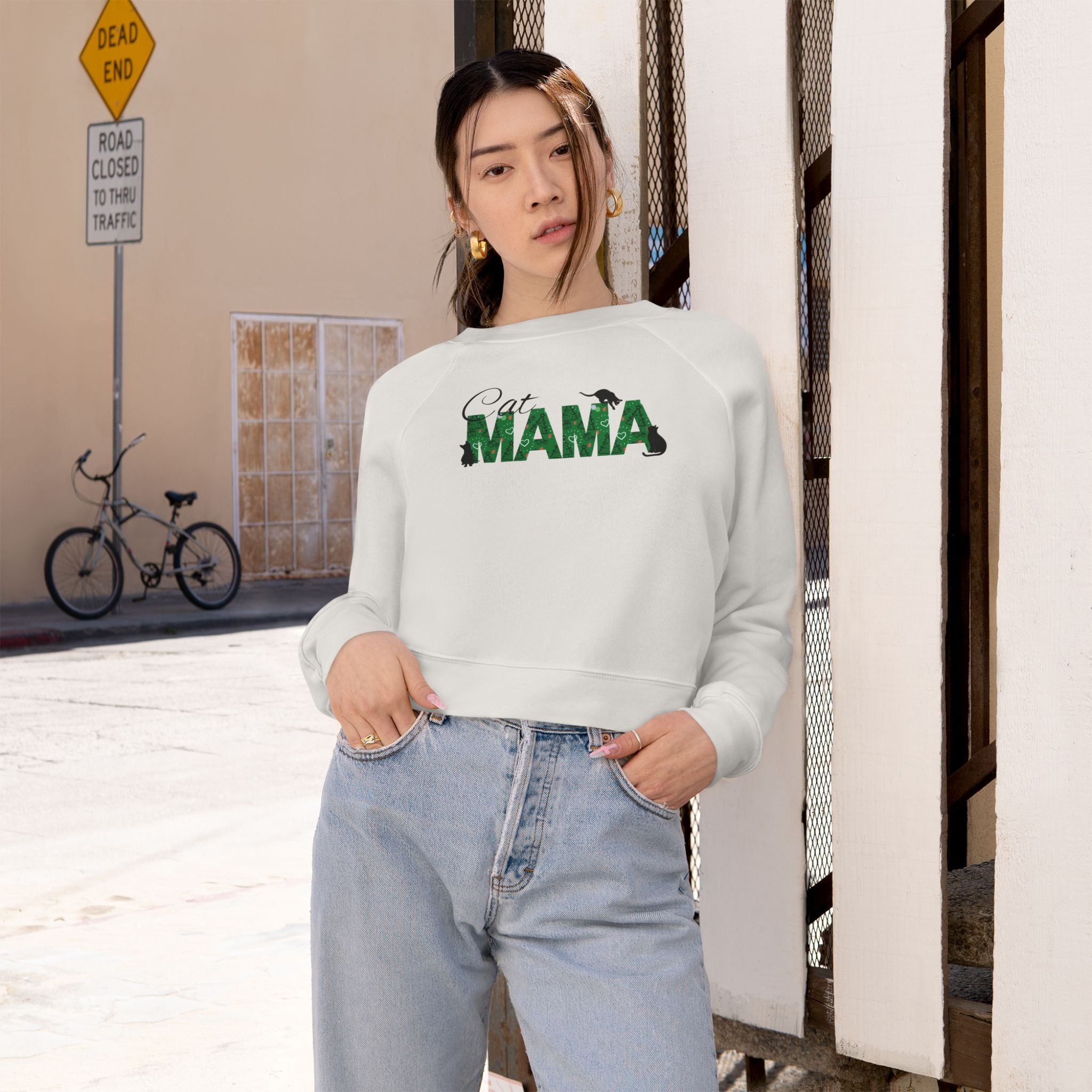 Photo depicting the ​Christmas Cat Mama Women's Cropped Fleece Pullover from EpiAl's Shop.