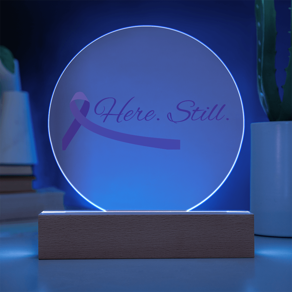 “Here. Still.” Acrylic Circle Plaque with Purple Ribbon — LED Light Base Included