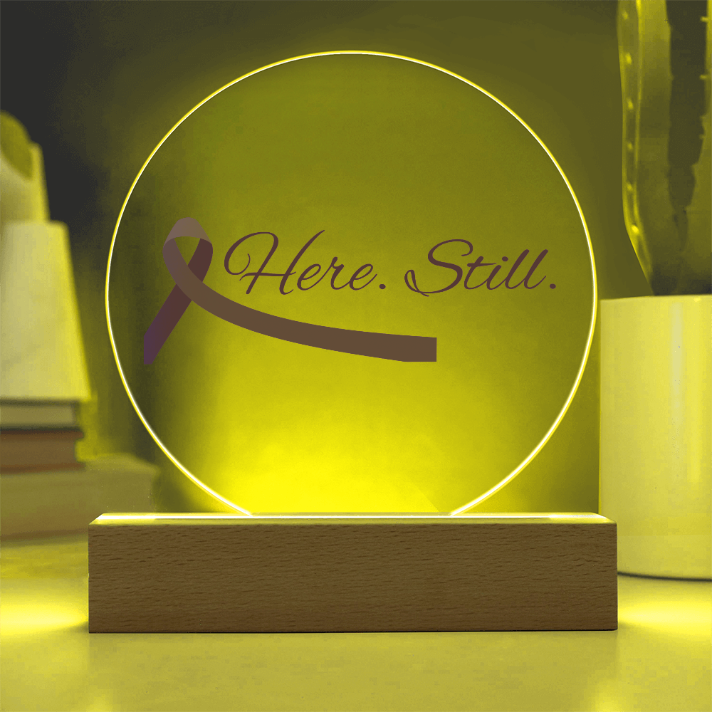 “Here. Still.” Acrylic Circle Plaque with Purple Ribbon — LED Light Base Included