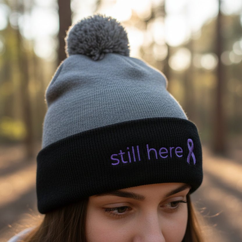 Still Here Pom-Pom Beanie – Epilepsy Awareness Knit Hat with Purple Ribbon - Hats, Beanie - EpiAl's Shop
